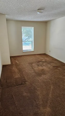 a room with a table and chairs