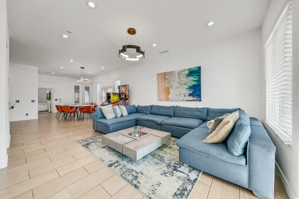a living room with furniture and a rug
