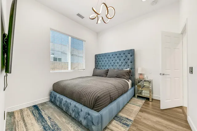 a bedroom with a bed and window