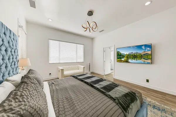 a bedroom with bed and a window