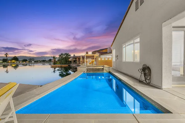 a view of a swimming pool with an ocean view