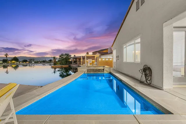 a view of a swimming pool with an ocean view