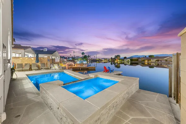 a view of a swimming pool with a lounge chairs