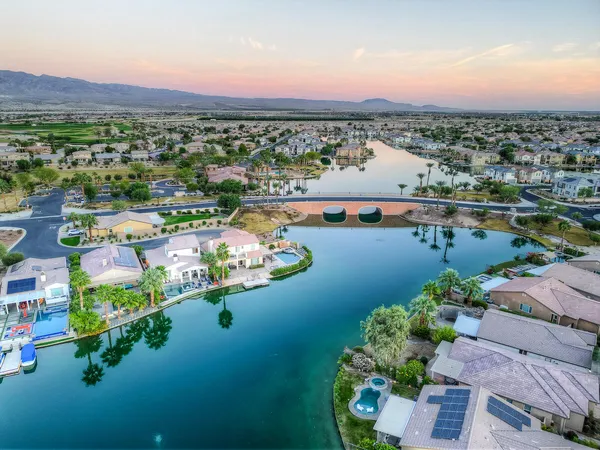 an aerial view of a house with a lake view