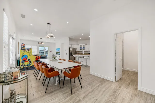 a view of a dining area with furniture and wooden floor