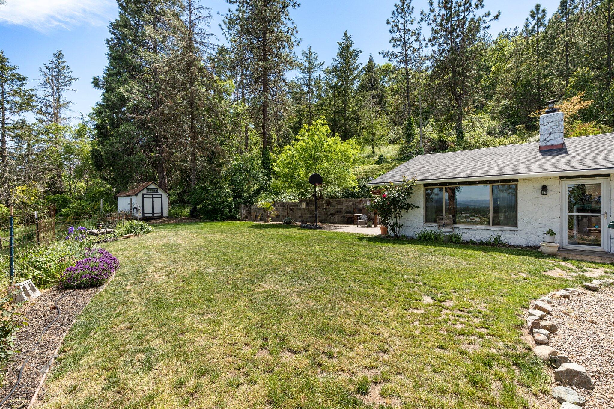 3765 Old Stage Road Central Point, OR 97502 - Photo 12 of 38 a front view of a house with garden