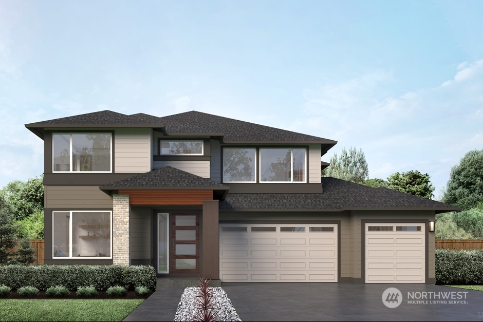 6551 Southeast 8th Street Renton, WA 98059 - Photo 1 of 11 a front view of a house with garage