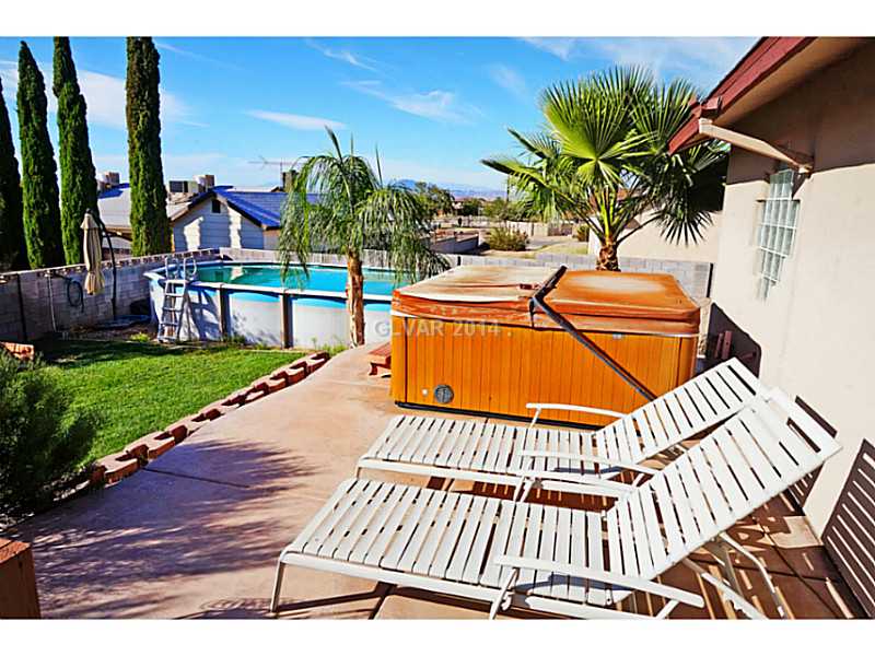 Property Photo. Relax in the spa or enjoy a swim in the above ground pool