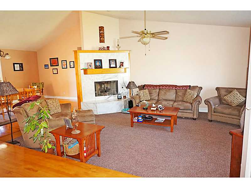 Property Photo. Sunken Family Room with marble tile surround fireplace