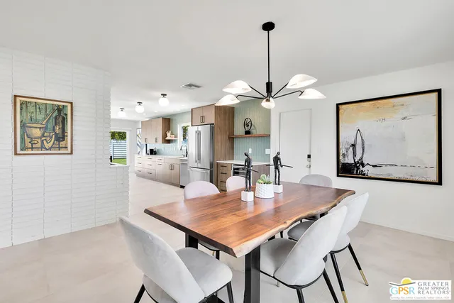 a dining room with furniture and window