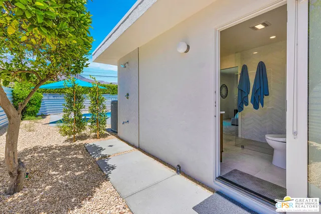a view of a hallway with a potted plant