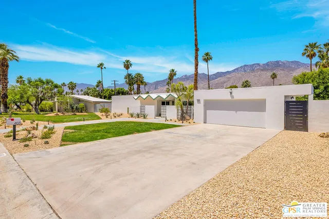 a view of a street with a houses