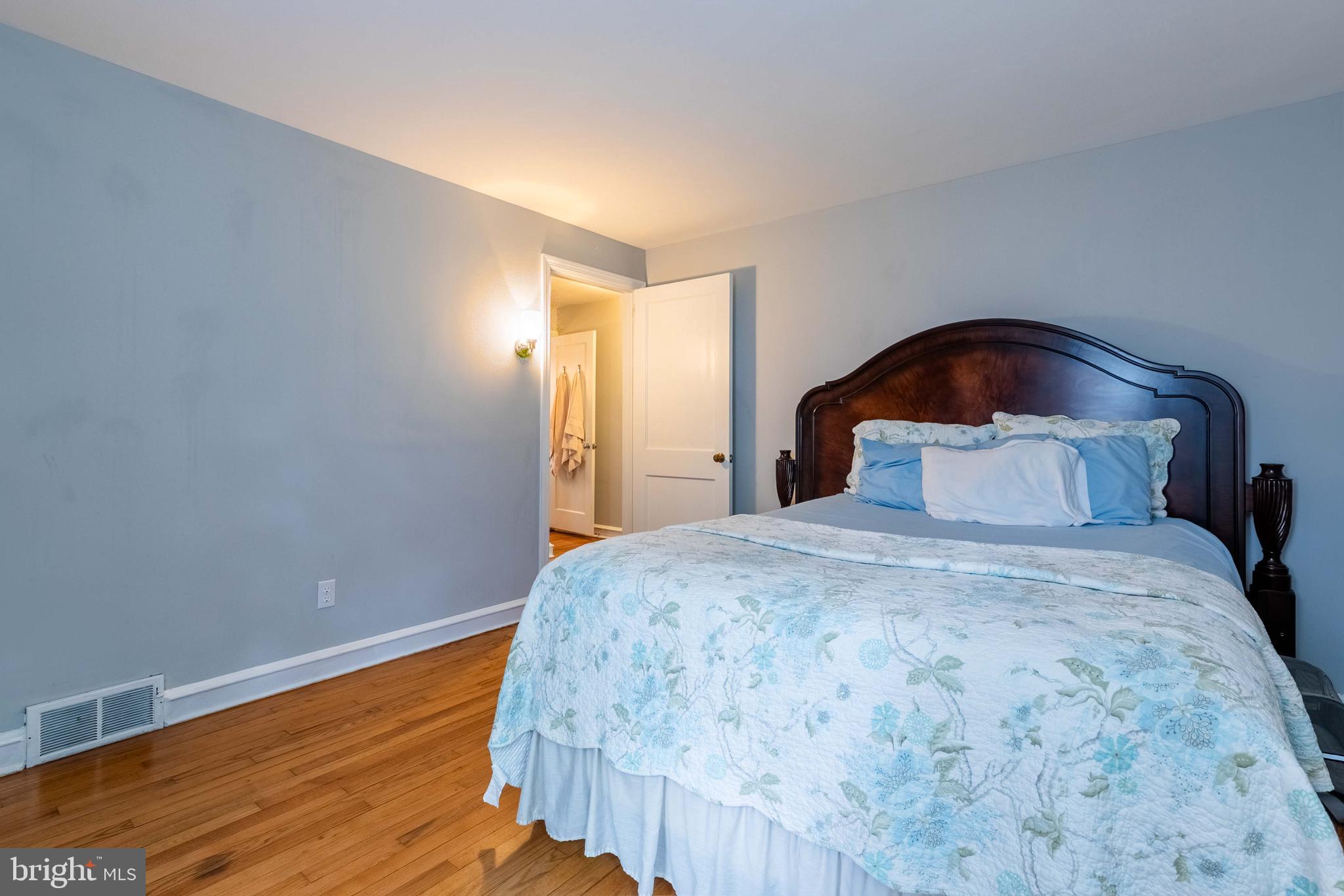1042 Thrush Lane Norristown, PA 19403 - Photo 22 of 30 a bedroom with bed and wooden floor