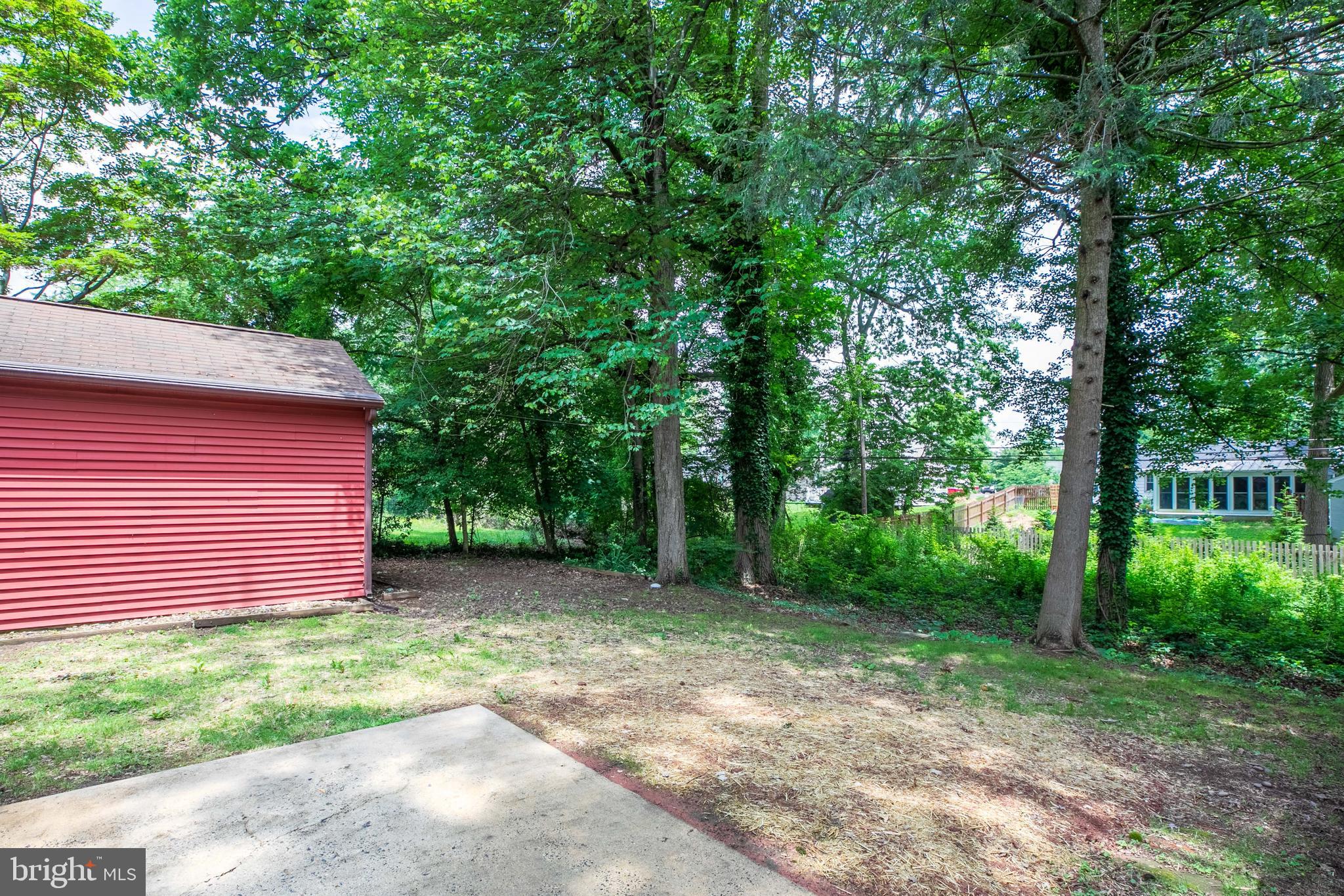 1042 Thrush Lane Norristown, PA 19403 - Photo 27 of 30 a yellow house in middle of the forest