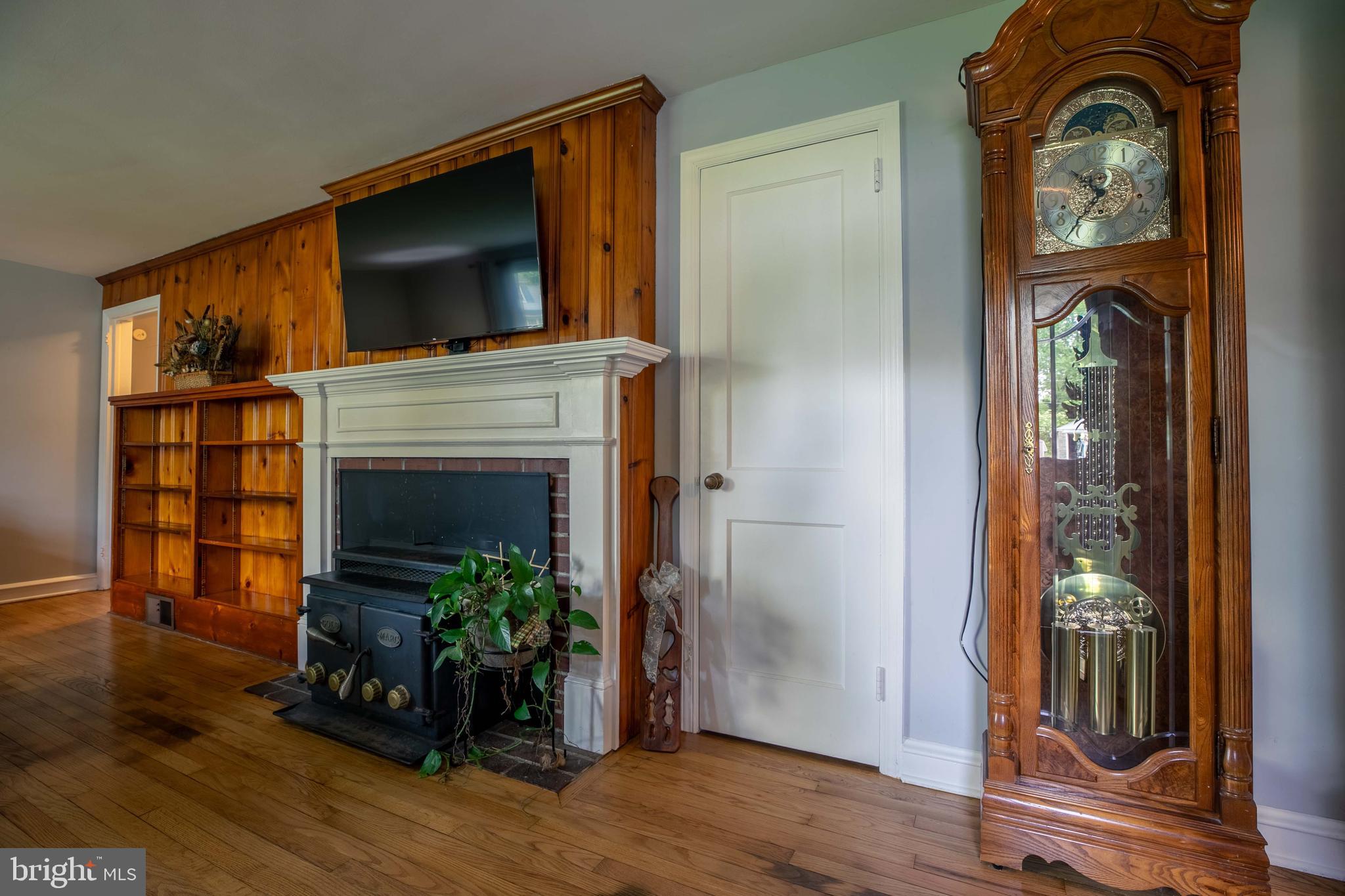 1042 Thrush Lane Norristown, PA 19403 - Photo 6 of 30 a living room with furniture a flat screen tv and a fireplace