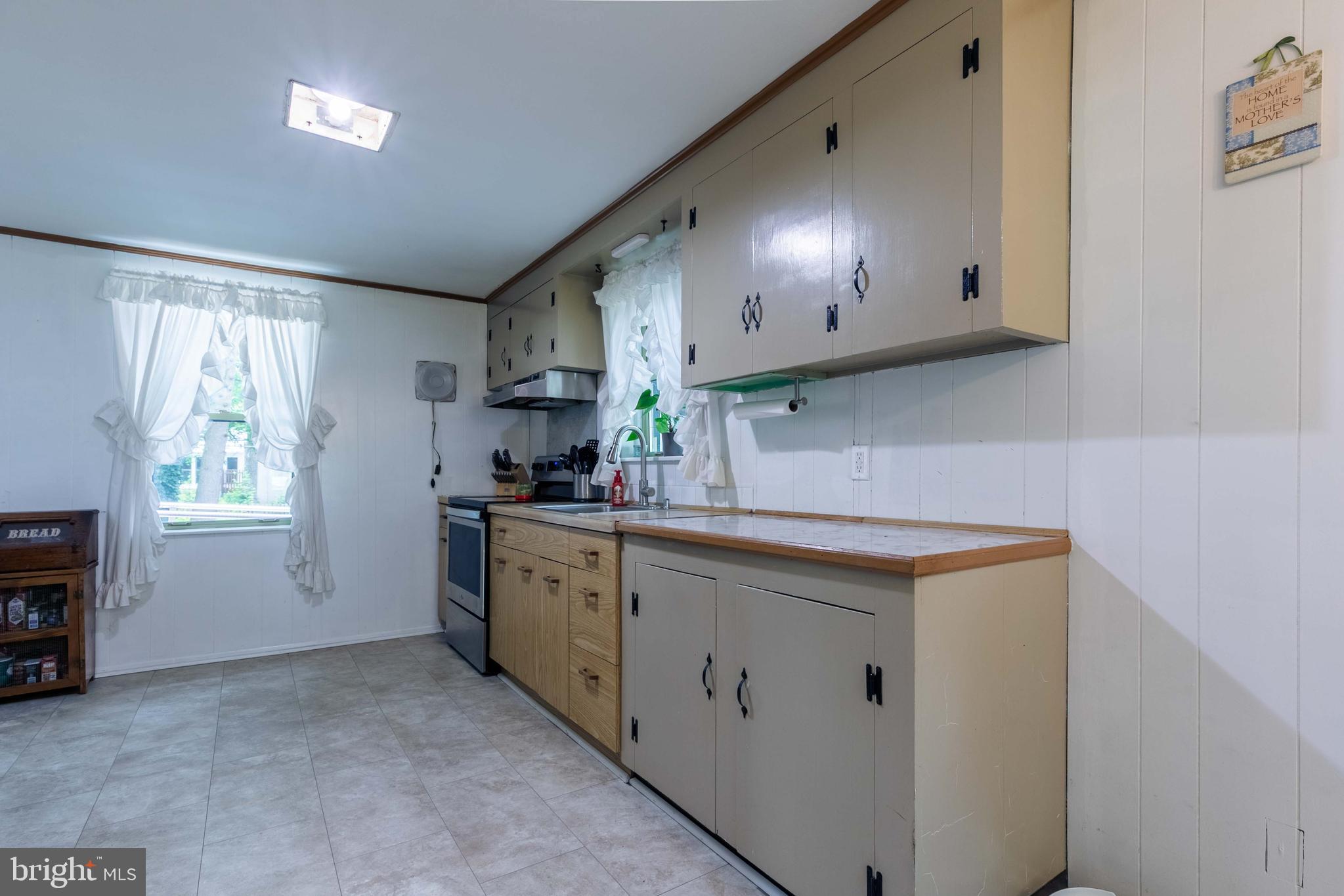 1042 Thrush Lane Norristown, PA 19403 - Photo 8 of 30 a kitchen with a sink cabinets and window