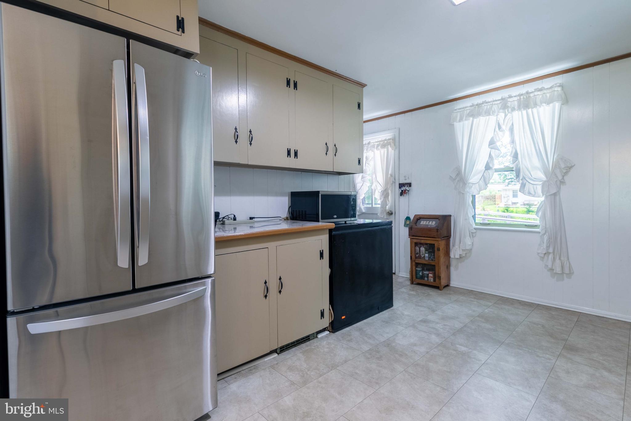 1042 Thrush Lane Norristown, PA 19403 - Photo 10 of 30 a kitchen with stainless steel appliances a refrigerator sink and cabinets