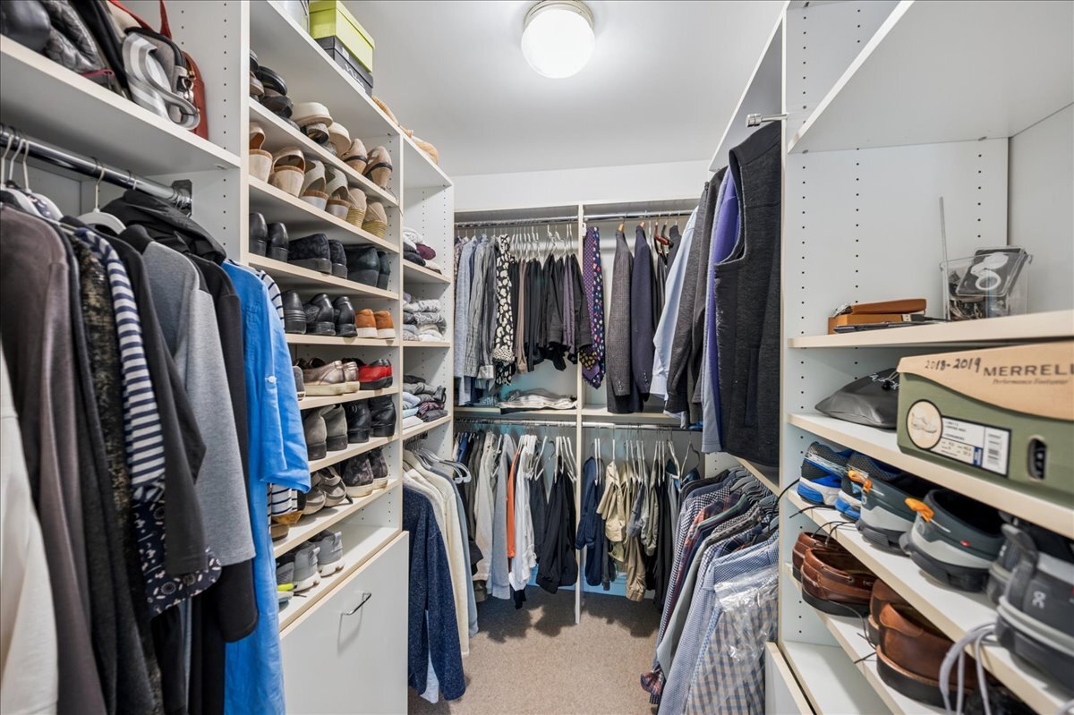 253 Summerfield Road Northbrook, IL 60062 - Photo 28 of 46 a view of walk in closet with clothes and shoes