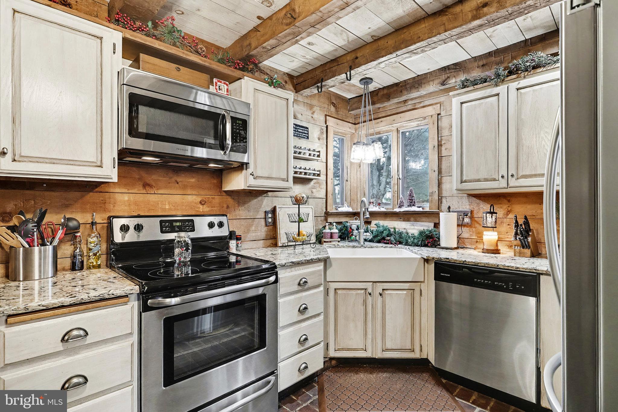 27 Ridge Road Lititz, PA 17543 - Photo 16 of 61 a kitchen with stainless steel appliances granite countertop a stove a sink and a microwave