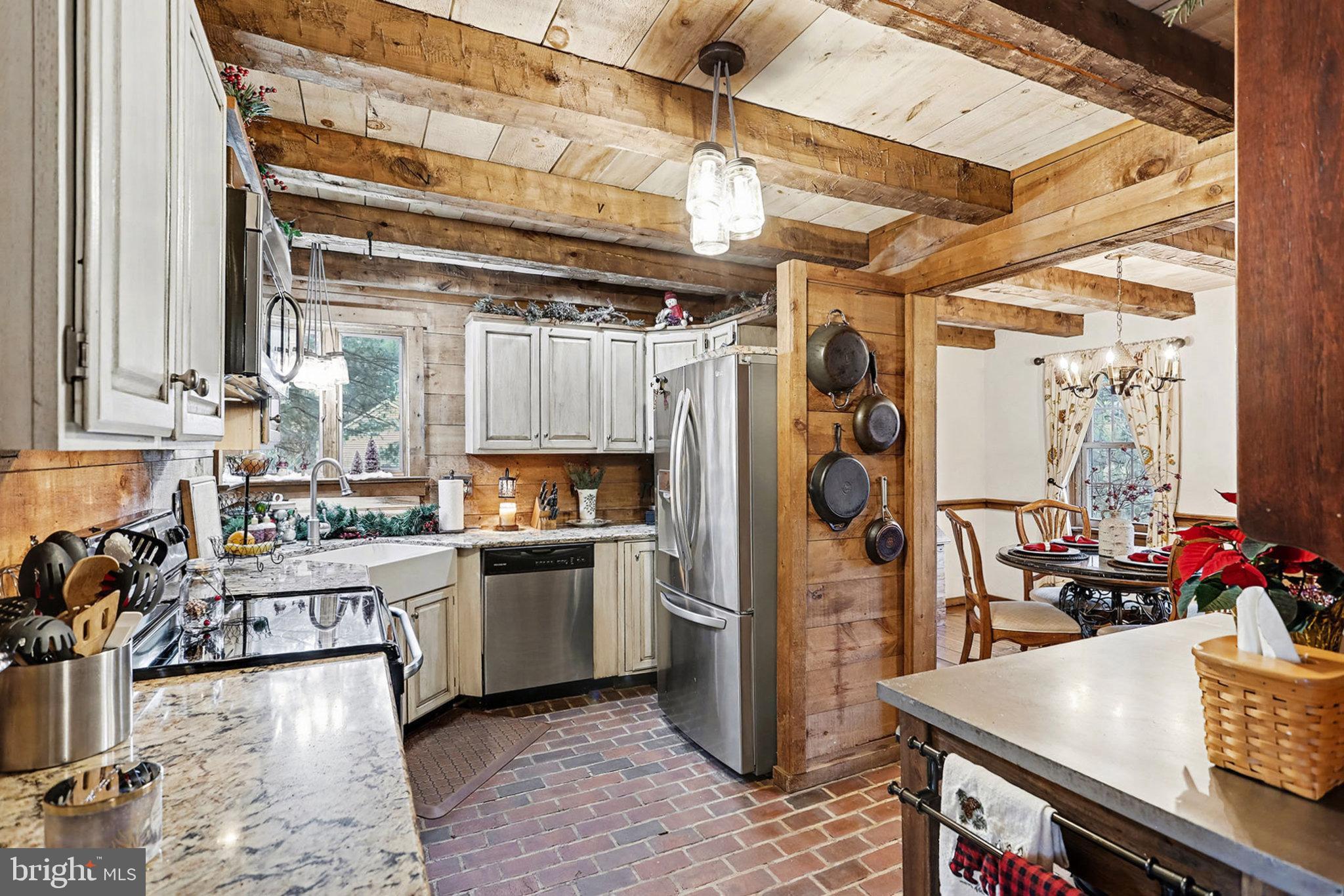 27 Ridge Road Lititz, PA 17543 - Photo 17 of 61 a kitchen with stainless steel appliances granite countertop a sink dishwasher and a refrigerator with wooden floor