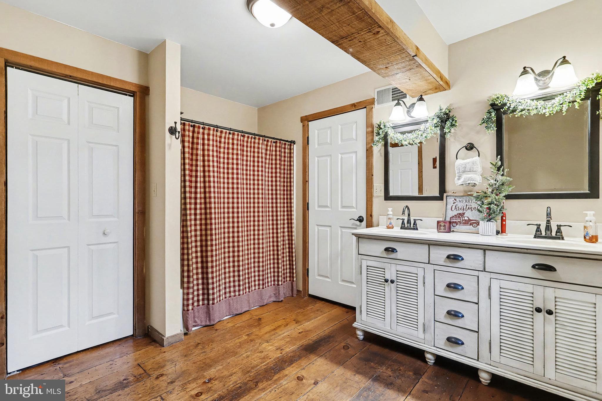 27 Ridge Road Lititz, PA 17543 - Photo 28 of 61 a spacious bathroom with a double vanity sink a large mirror and a bathtub