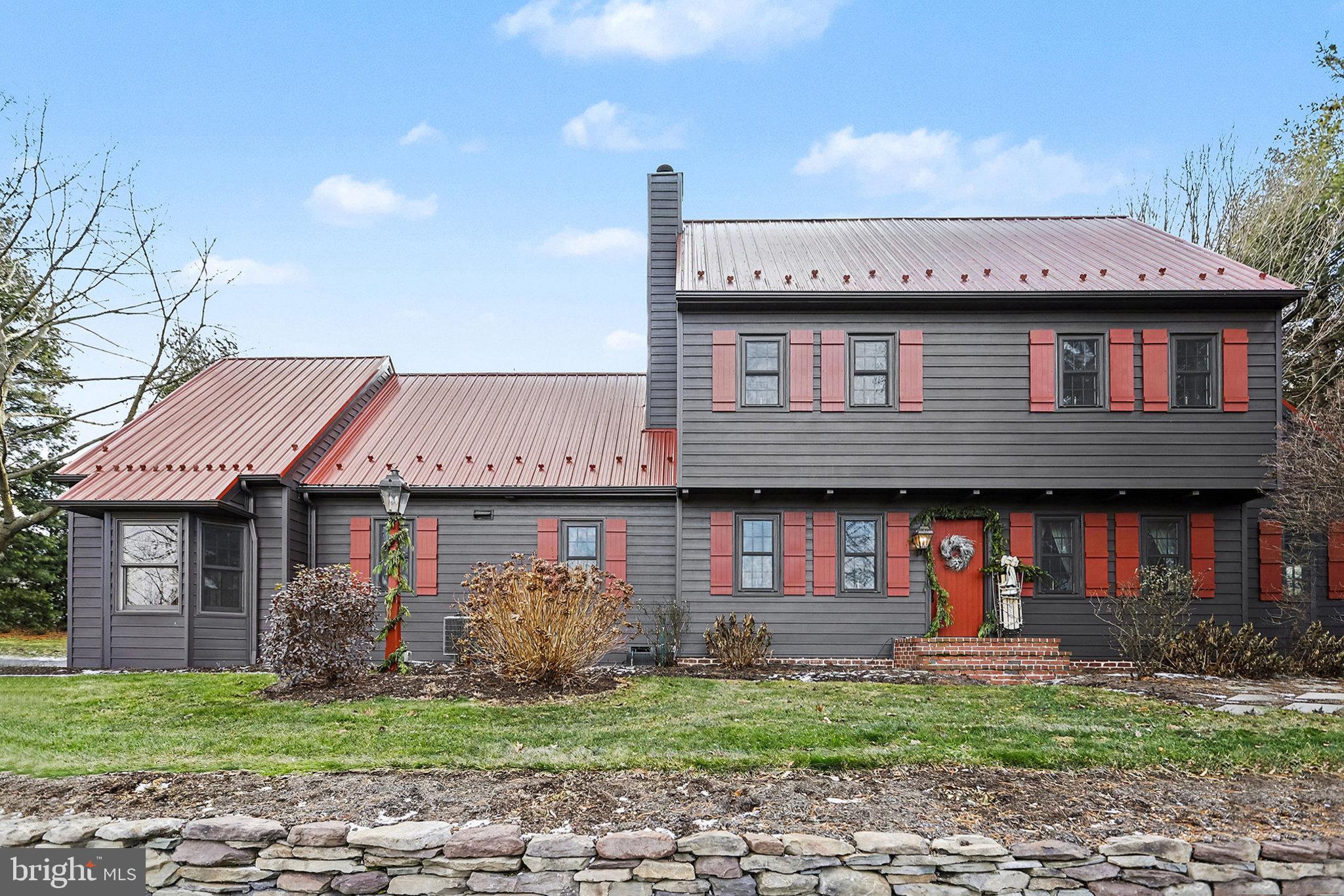 27 Ridge Road Lititz, PA 17543 - Photo 3 of 61 a front view of a house with a garden