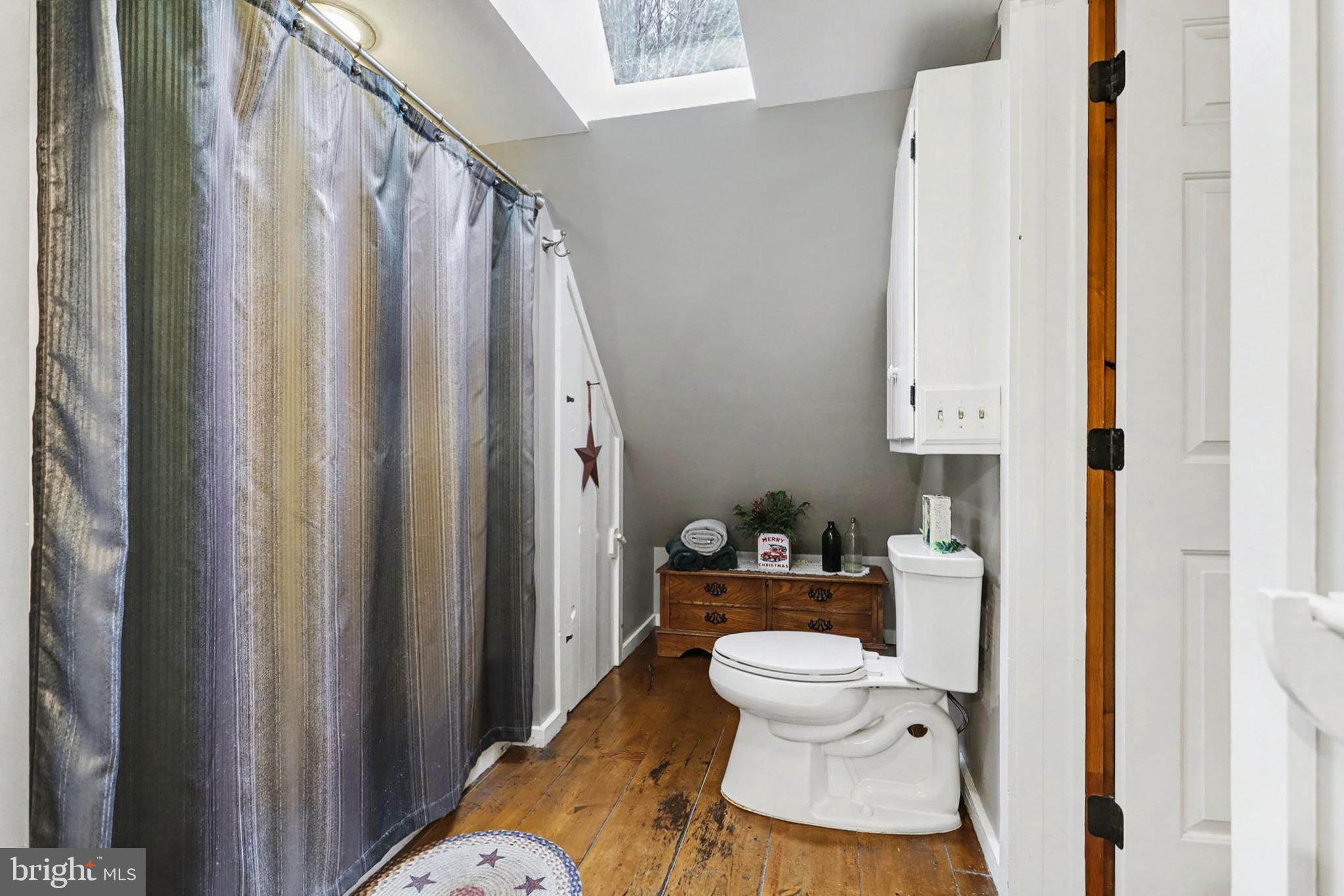 27 Ridge Road Lititz, PA 17543 - Photo 34 of 61 a bathroom with a toilet and a shower curtain