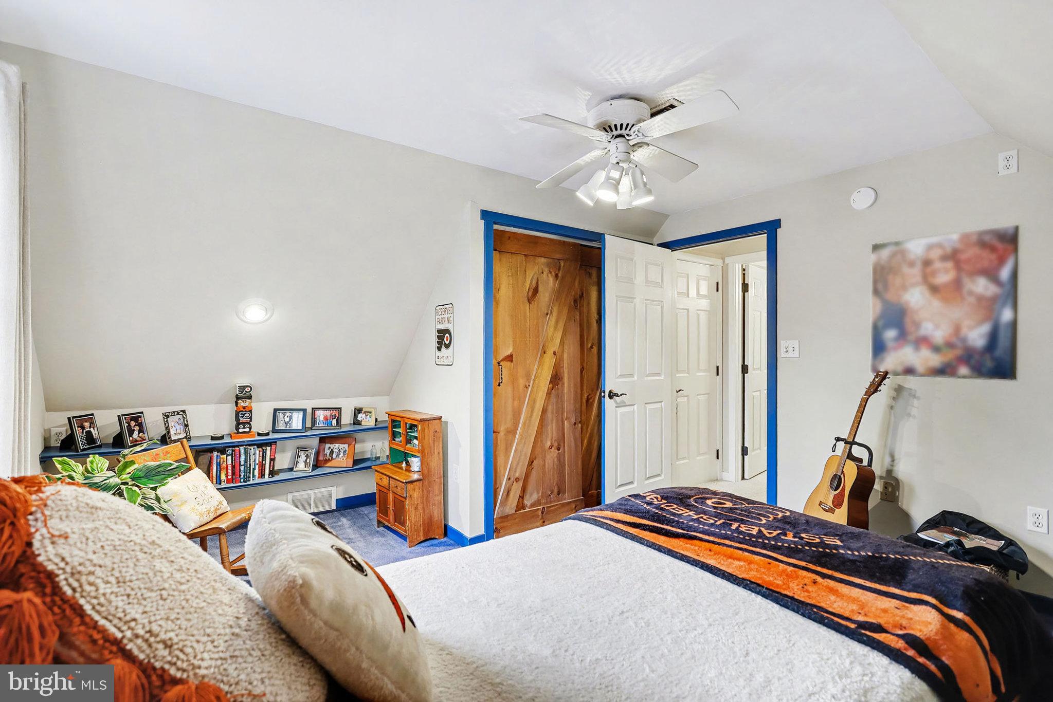 27 Ridge Road Lititz, PA 17543 - Photo 40 of 61 a bedroom with a bed and a chandelier