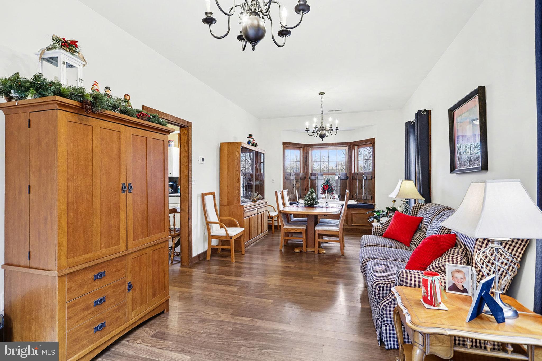 27 Ridge Road Lititz, PA 17543 - Photo 43 of 61 a living room with furniture or couch and a chandelier