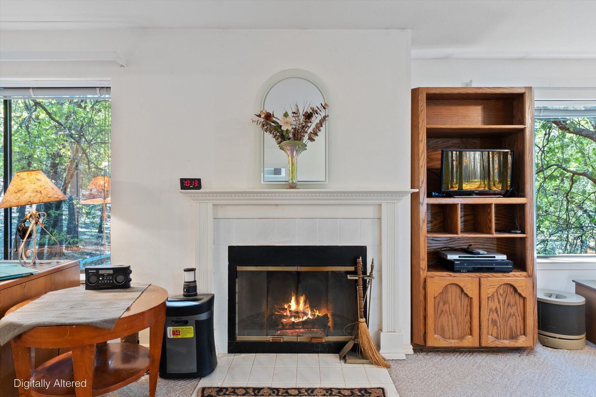 26997 Lookout Mountain Road Oak Run, CA 96069 - Photo 32 of 92 a living room with furniture and a fireplace