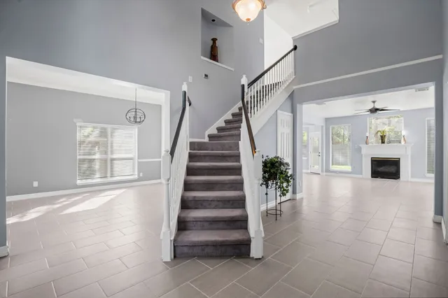 a view of entryway and hall with a living room
