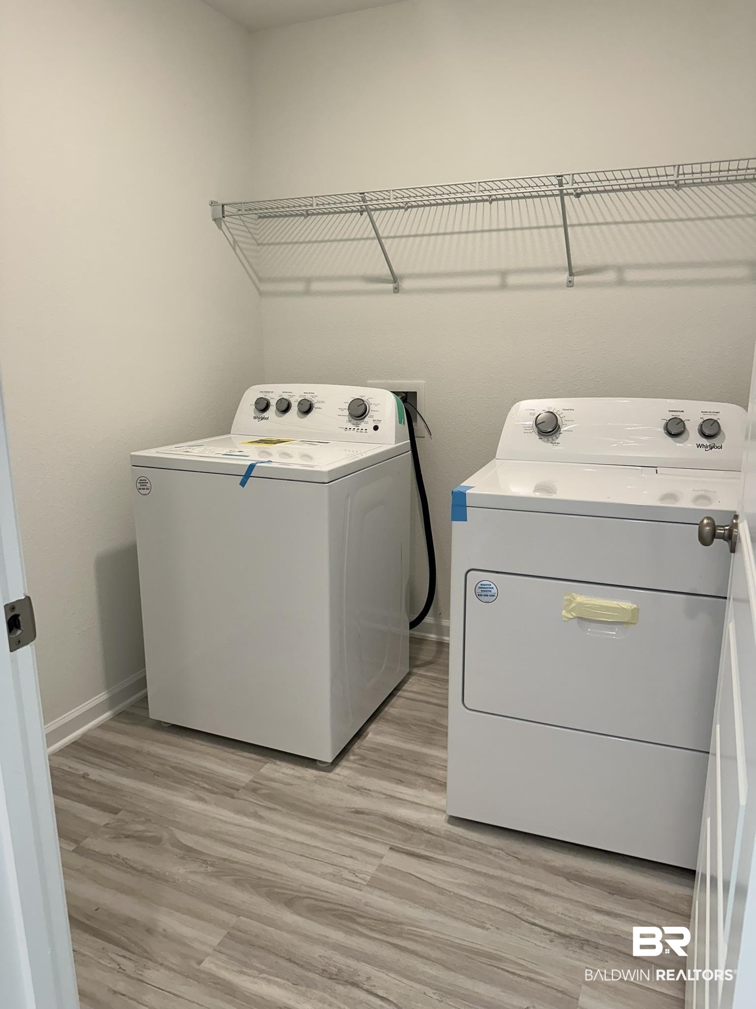 22227 Aleutian Avenue Foley, AL 36535 - Photo 13 of 64 Clothes washing area featuring light hardwood / wood-style floors and separate washer and dryer