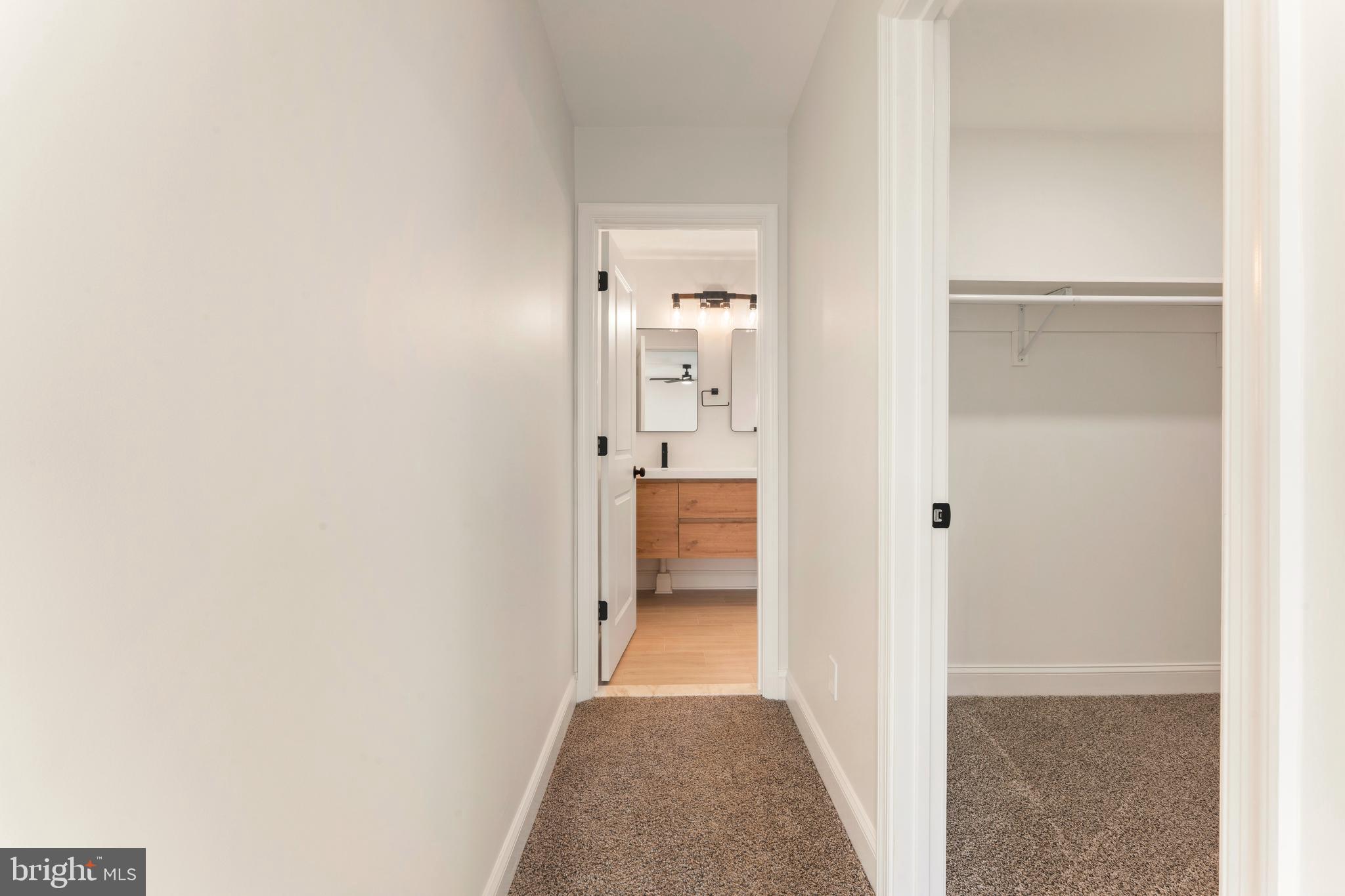 122 Ivy Hill Road Levittown, PA 19057 - Photo 23 of 36 a view of a hallway with wooden floor