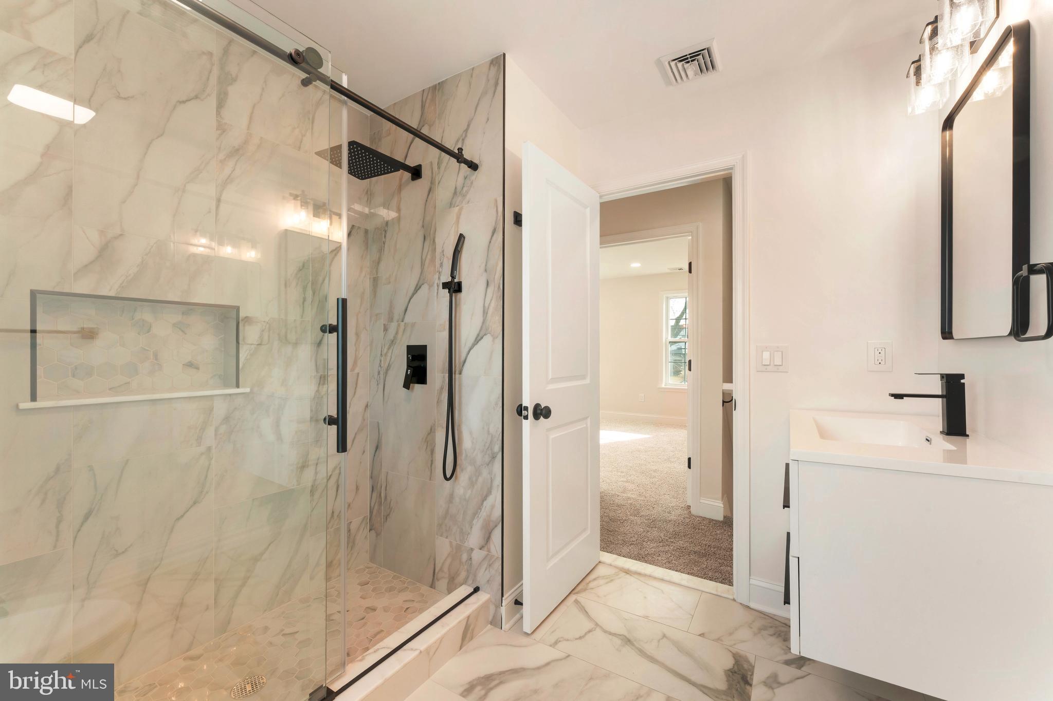 122 Ivy Hill Road Levittown, PA 19057 - Photo 32 of 36 a bathroom with a shower and a sink