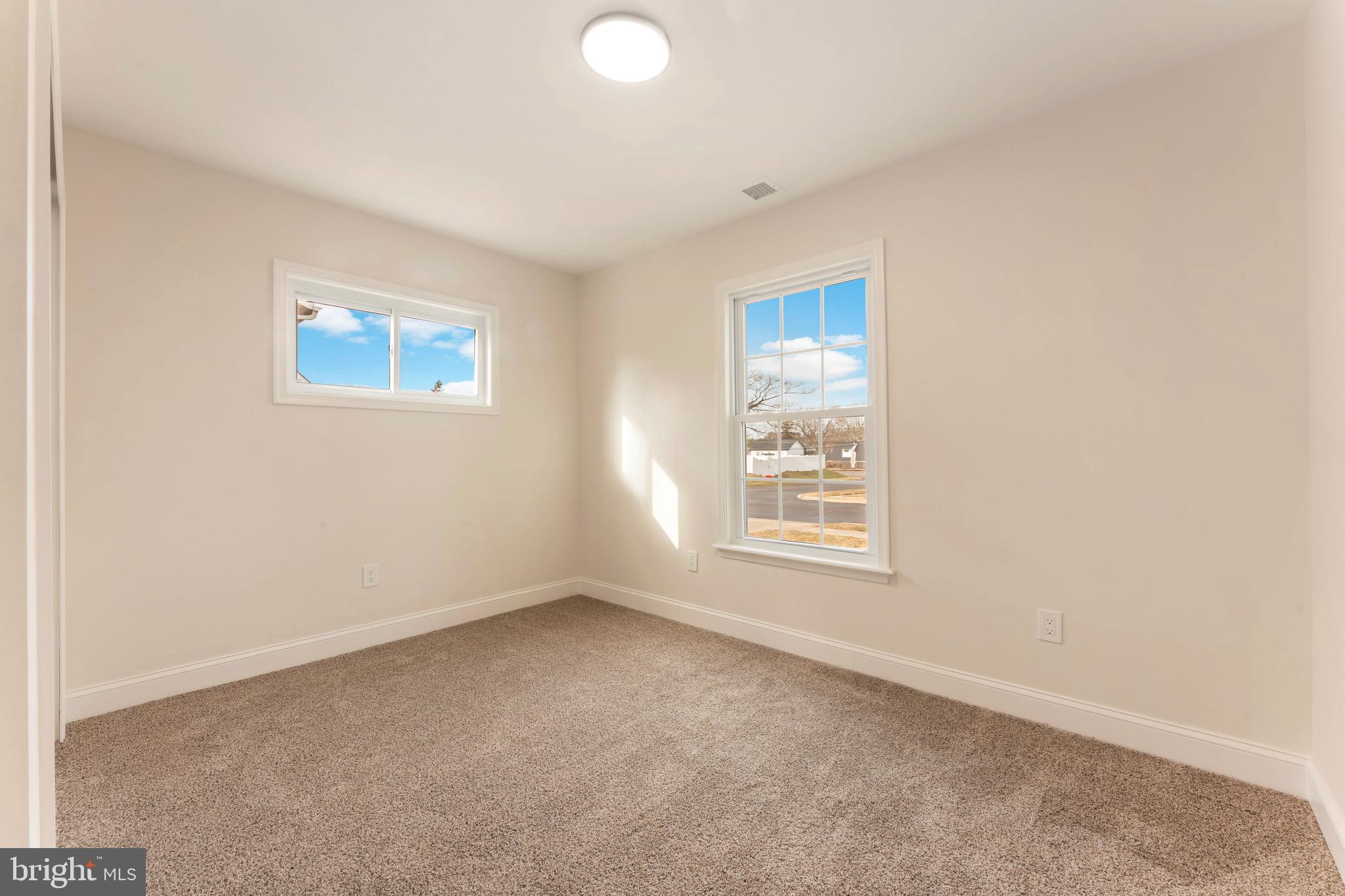122 Ivy Hill Road Levittown, PA 19057 - Photo 33 of 36 an empty room with a window