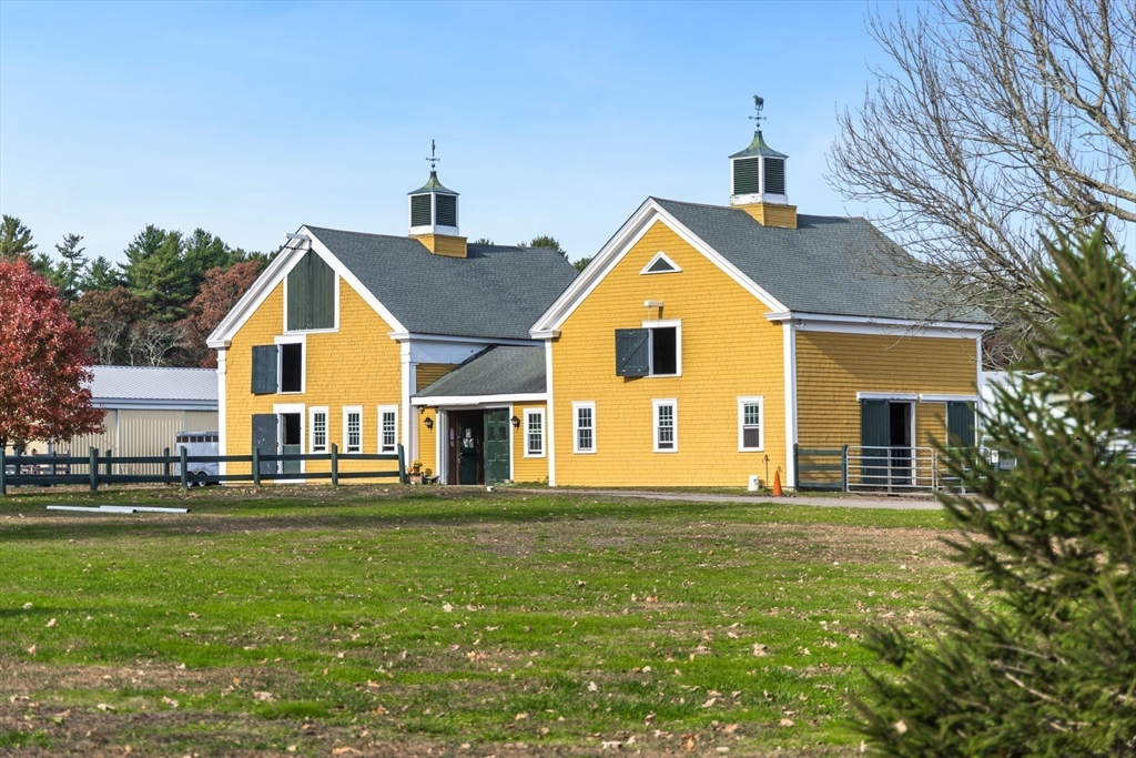 0 Marys Pond Road Rochester, MA 02770 - Photo 13 of 19 a front view of a house with a garden