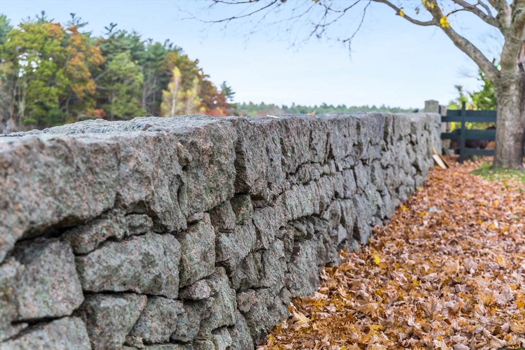 0 Marys Pond Road Rochester, MA 02770 - Photo 16 of 19 a view of a dry yard with wooden fence