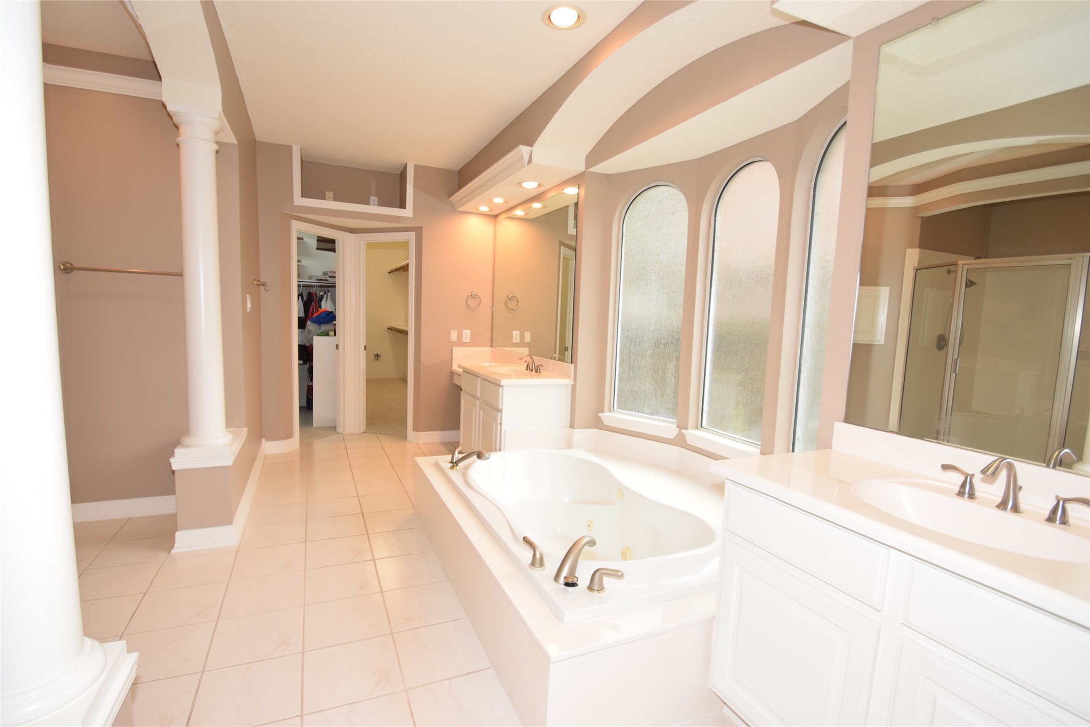 22018 Rustic Shores Lane Katy, TX 77450 - Photo 24 of 46 Primary bath offering two sink areas, jetted tub, separate dual shower and two walk-in closets.