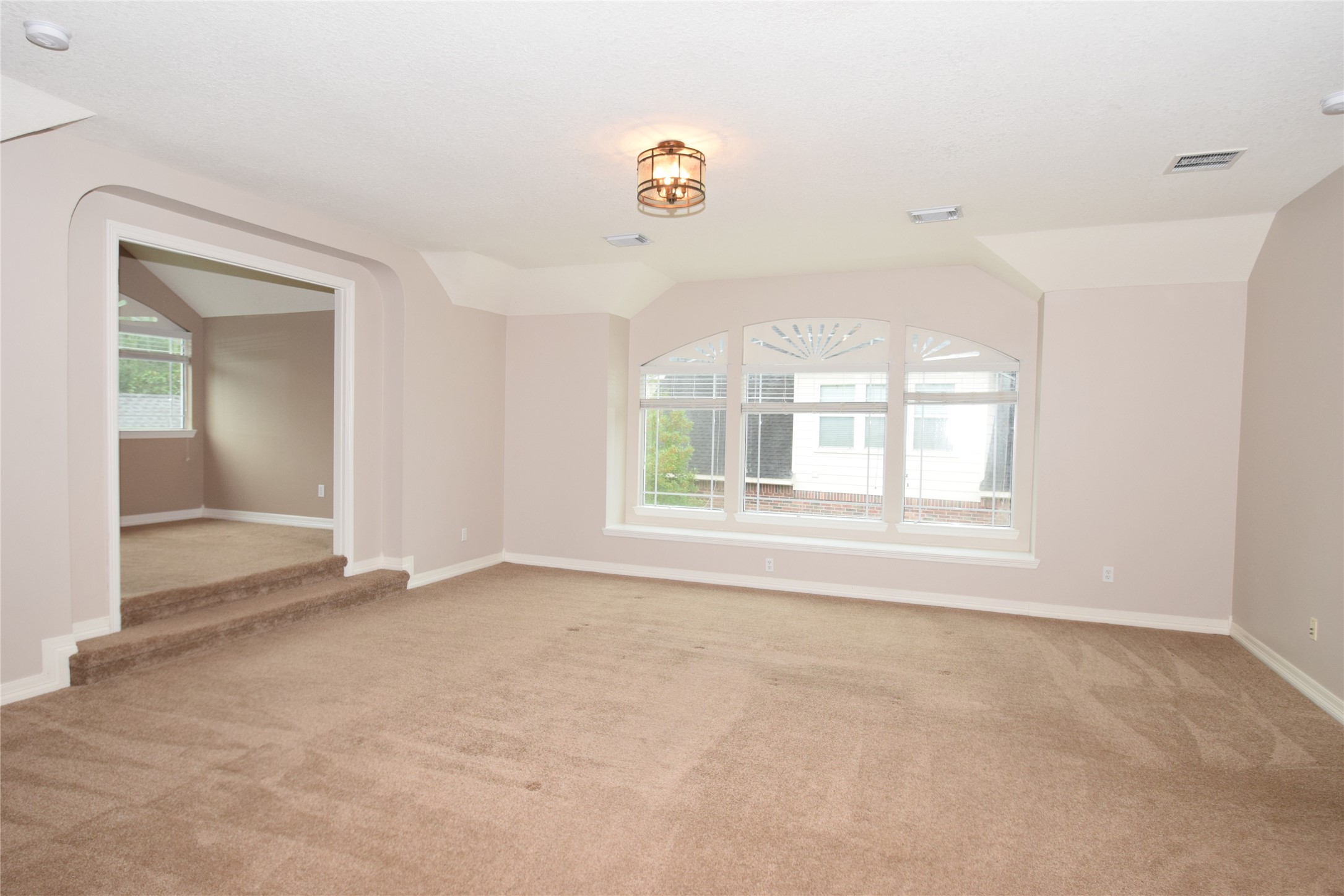 22018 Rustic Shores Lane Katy, TX 77450 - Photo 33 of 46 Grand game room with raised ceilings, box window, access to a hidden room and steps up to the card room.