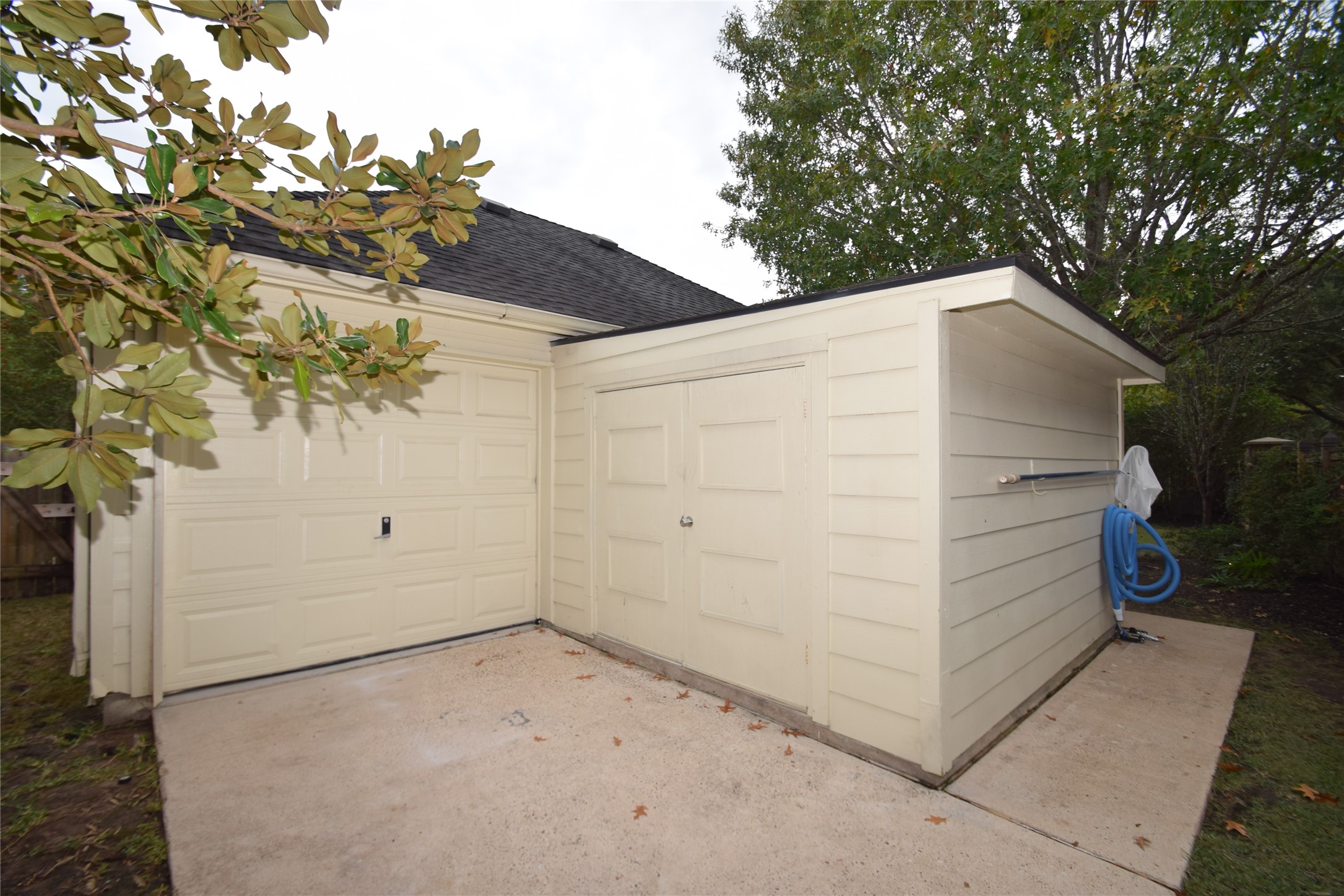 22018 Rustic Shores Lane Katy, TX 77450 - Photo 45 of 46 Behind the 3 car garage is a separate storage room.