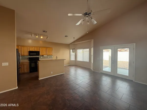a view of a kitchen with a sink and a window