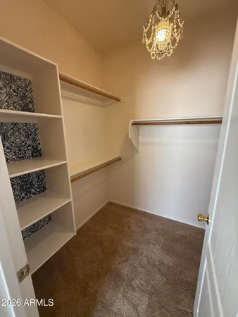 a view of room with racks on the wall