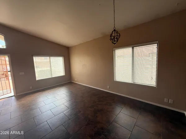 a view of an empty room with windows