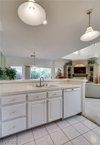 5272 Island Chain Road Las Vegas, NV 89118 - Photo 21 of 31 A functional kitchen with a practical layout, featuring light cabinetry and a white tiled countertop.