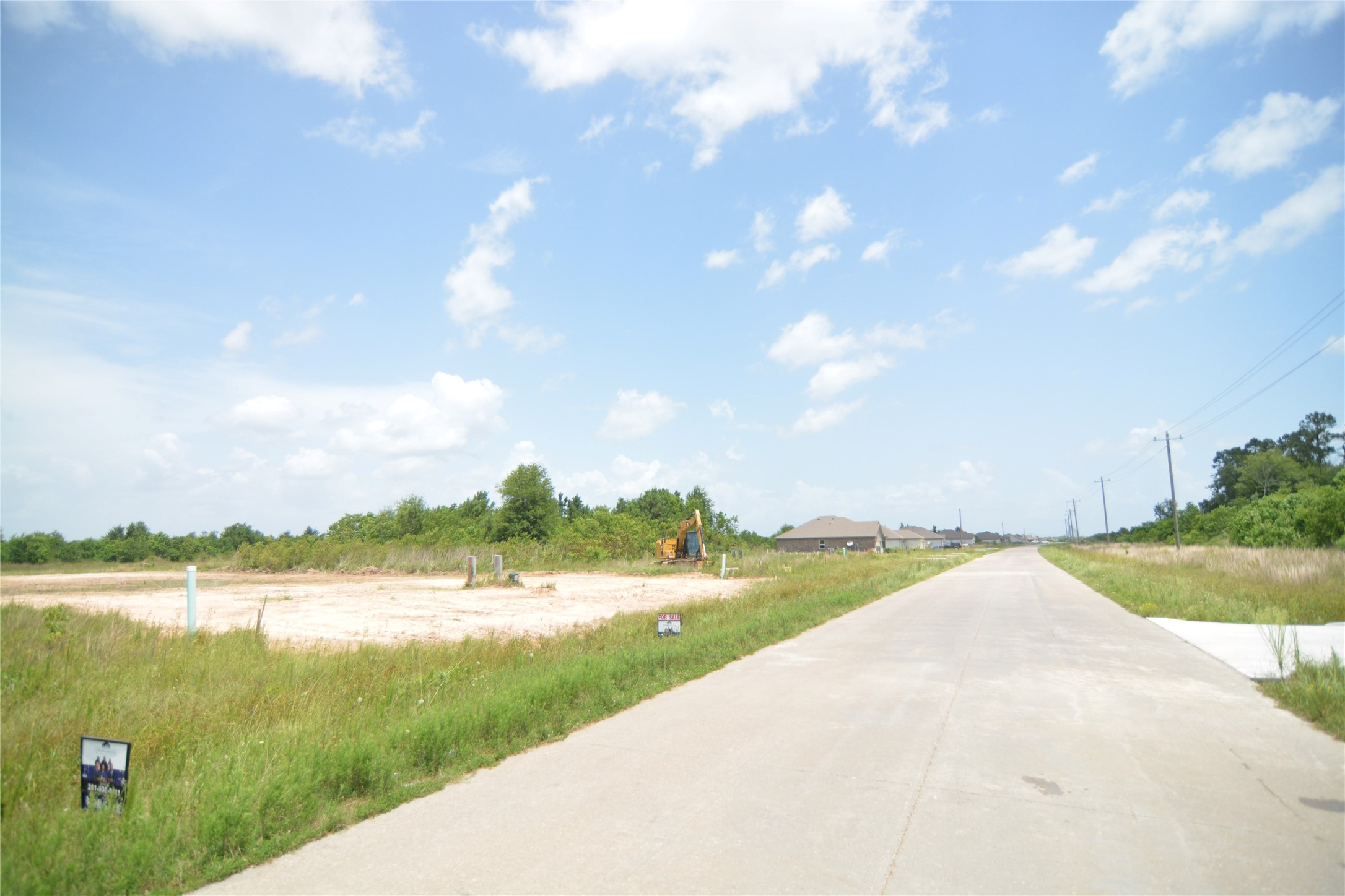 7714 Amanda Road Cleveland, TX 77327 - Photo 6 of 16 a view of a lake with a big yard