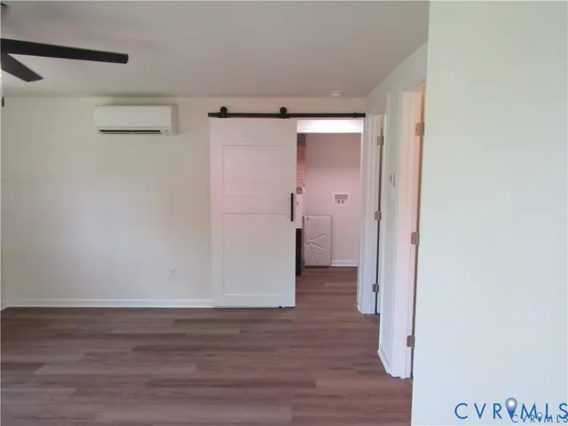 a view of hallway with wooden floor