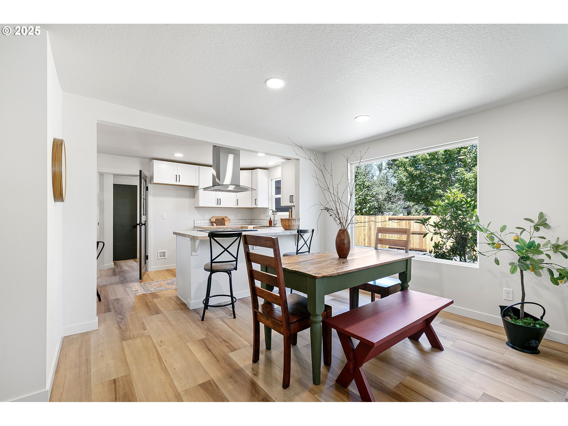 1938 7th Street Springfield, OR 97477 - Photo 11 of 48 a view of a dining room with furniture window and wooden floor