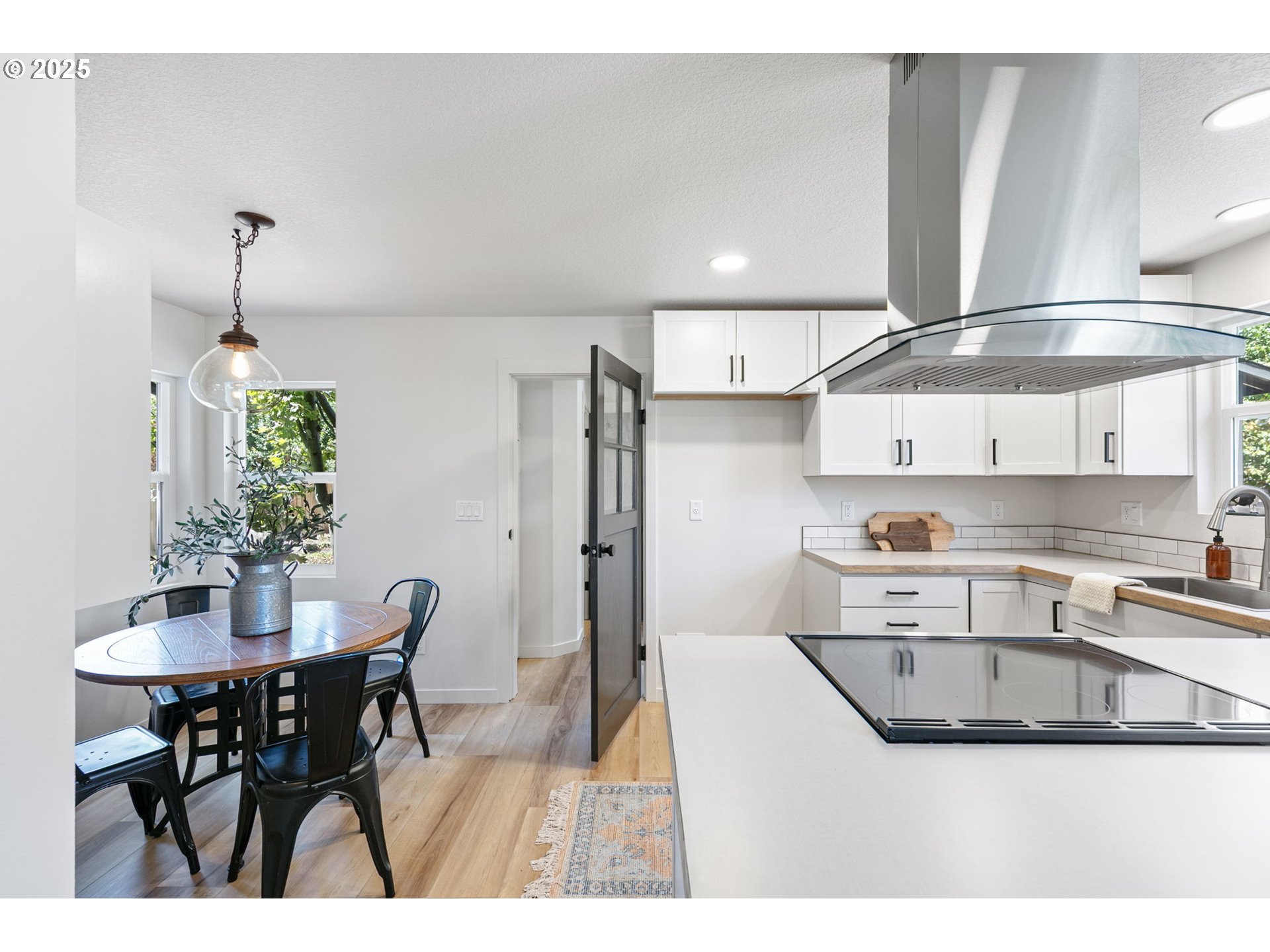1938 7th Street Springfield, OR 97477 - Photo 13 of 48 a kitchen with stainless steel appliances kitchen island granite countertop a sink and cabinets