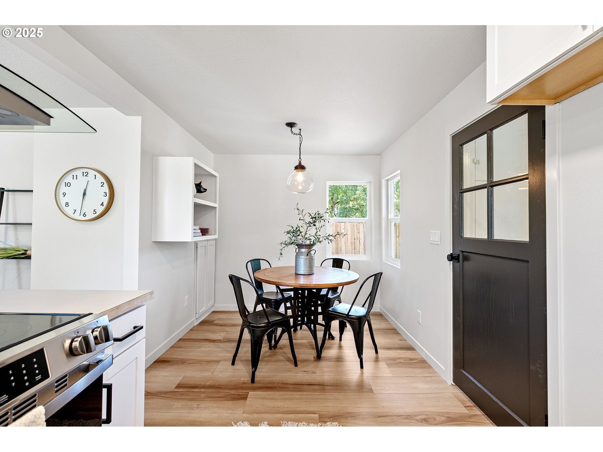 1938 7th Street Springfield, OR 97477 - Photo 17 of 48 a view of a dining room with furniture window and wooden floor