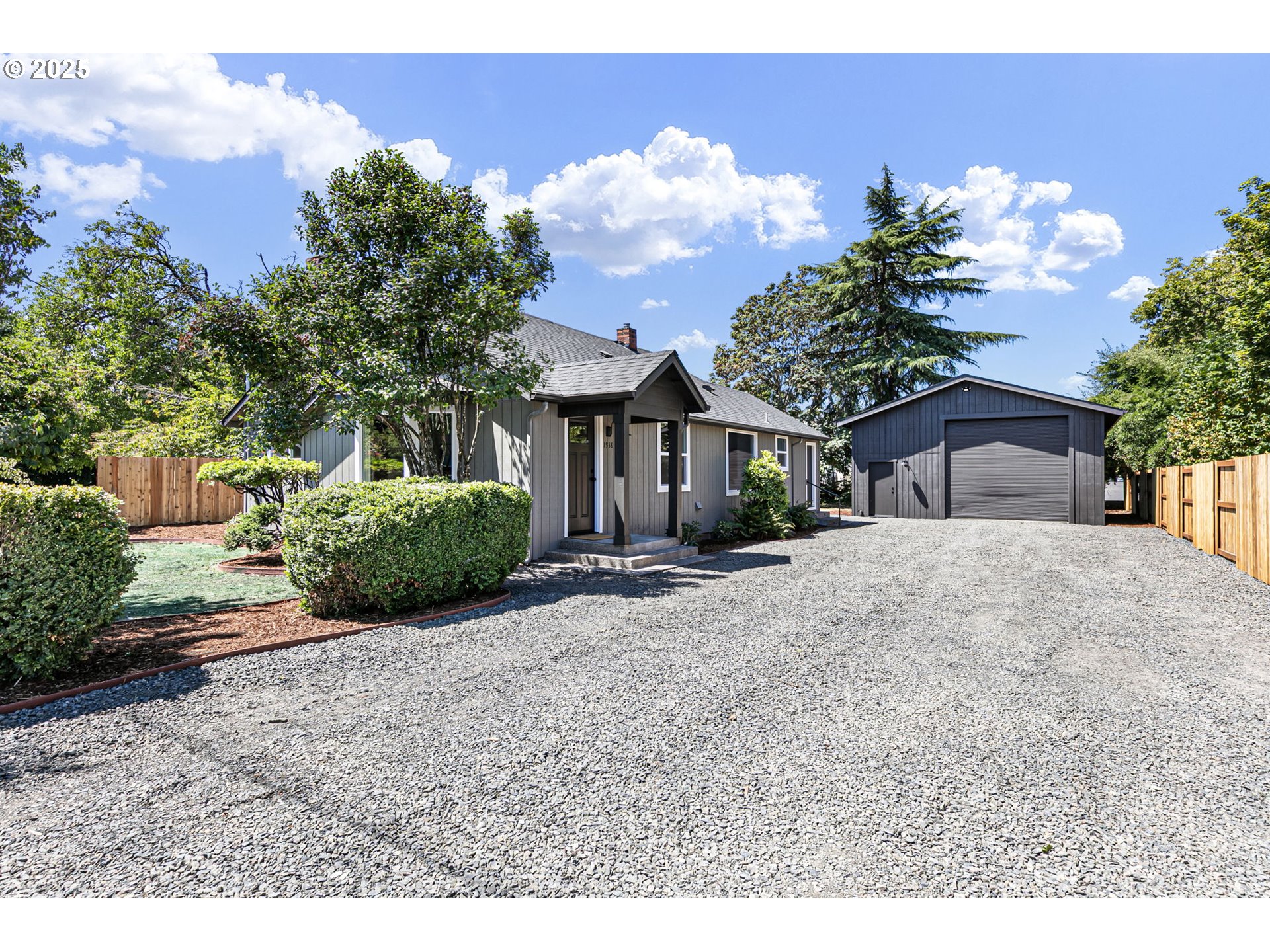 1938 7th Street Springfield, OR 97477 - Photo 2 of 48 a front view of a house with a yard and garage